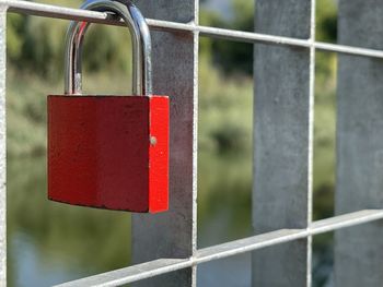 Close-up of padlocks on railing