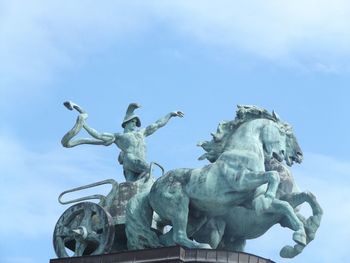 Low angle view of statue against sky