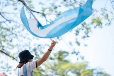 Woman waving argentinian flag celebration soccer victory fifa world cup 2022