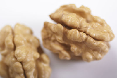 Close-up of walnuts against white background