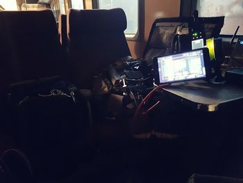 Young man using mobile phone on table