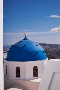 Anastasis church with its blue dome and tower in imerovigli village, santorini, greece