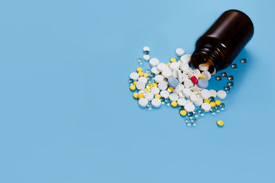 High angle view of bottle against blue background