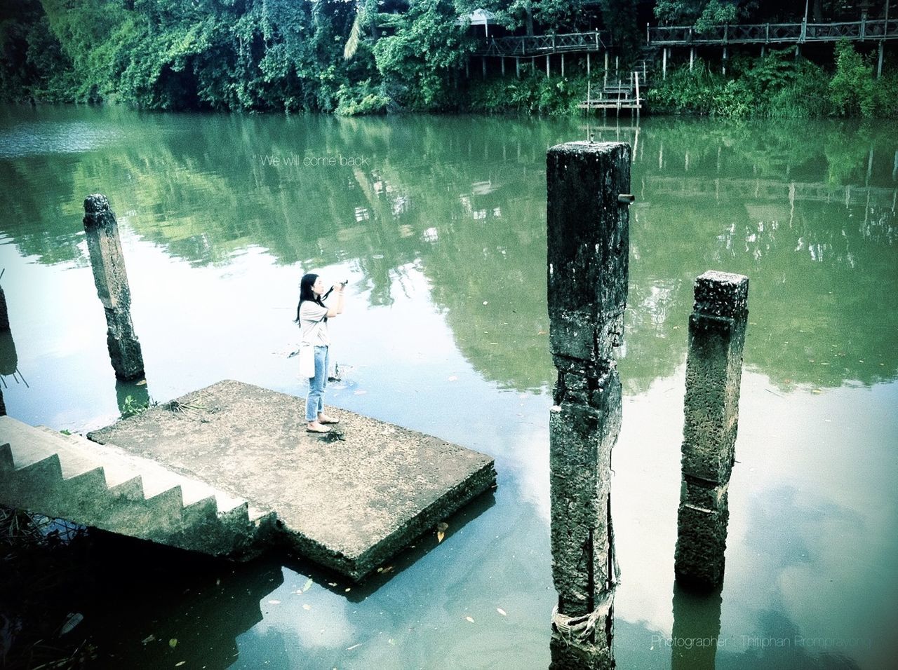 water, reflection, lake, waterfront, built structure, day, nature, tranquility, standing water, river, outdoors, high angle view, no people, architecture, wooden post, tranquil scene, building exterior, sea, pier, pole