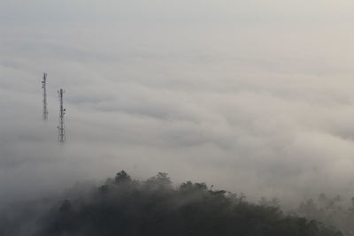 Low angle view of communications tower against sky