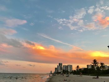 Scenic view of beach against sky during sunset