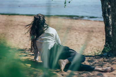 Woman sitting on beach