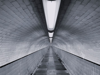 Low angle view of empty tunnel