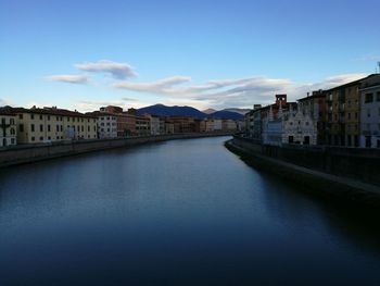 River in town against sky