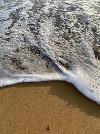 High angle view of waves on beach