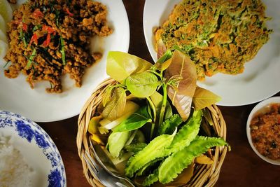 High angle view of leaves in plate on table