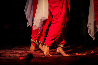 Low section of people dancing at night