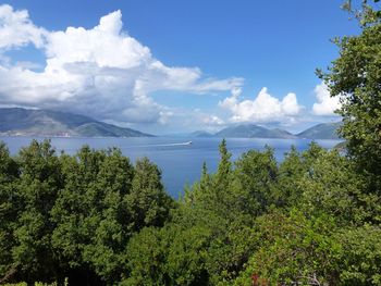 Scenic view of lake against cloudy sky