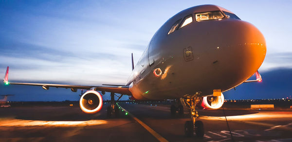 Close-up of airplane against sky