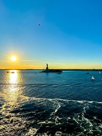 Scenic view of sea against sky during sunset