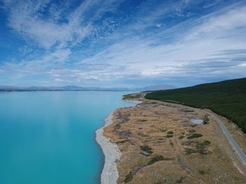 Scenic view of sea against blue sky