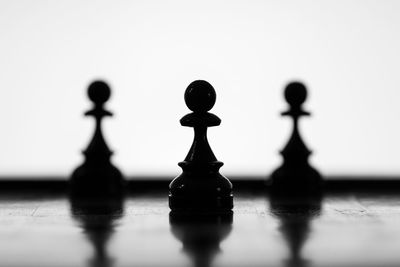 Close-up of silhouette chess board