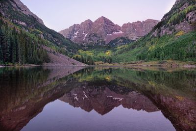 Scenic view of lake with mountains in background