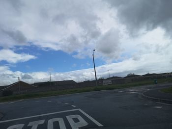 Road against sky seen through car windshield