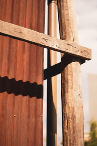 Low angle view of wooden fence