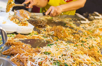 Close-up of man preparing food