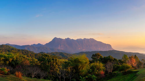 Scenic view of mountains against sky during sunset