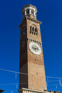 Low angle view of tower against clear blue sky