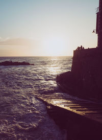 Scenic view of sea against clear sky during sunset