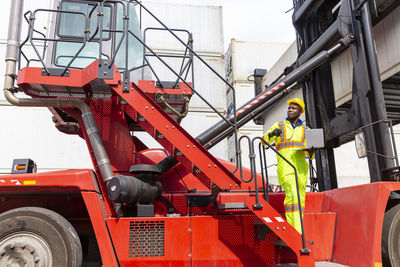 Low angle view of worker working at construction site