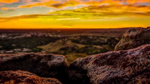 Close-up of rock formation against sky during sunset