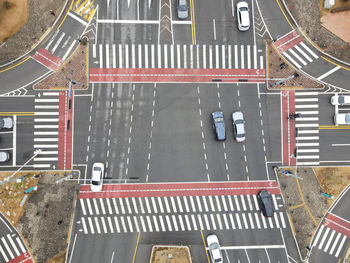 The movement of cars at crossroads in the city, aerial view.