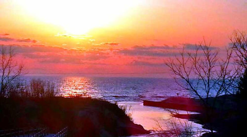 Scenic view of sea at sunset