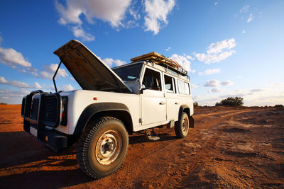 Land vehicle with sky in background