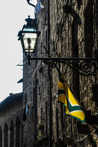 Low angle view of flags in city