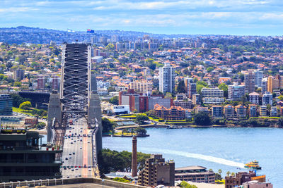 High angle view of river amidst buildings against sky