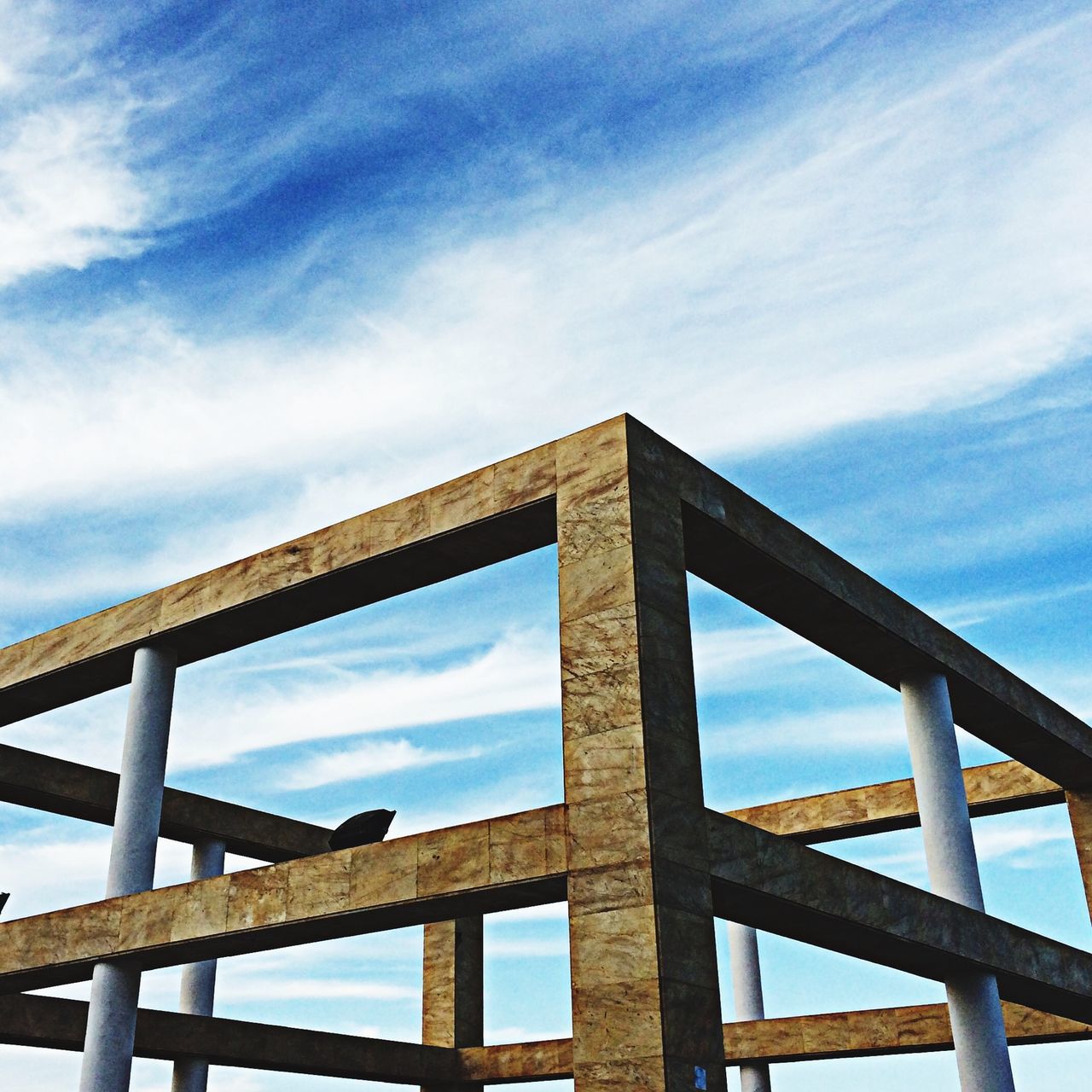 low angle view, sky, built structure, architecture, cloud - sky, cloud, blue, connection, cloudy, railing, metal, day, outdoors, bridge - man made structure, no people, engineering, nature, metallic, building exterior, high section