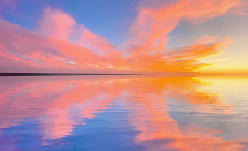 Scenic view of sea against orange sky
