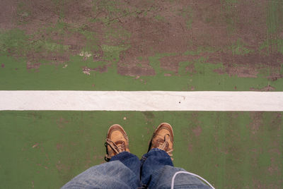 Low section of man standing on court 