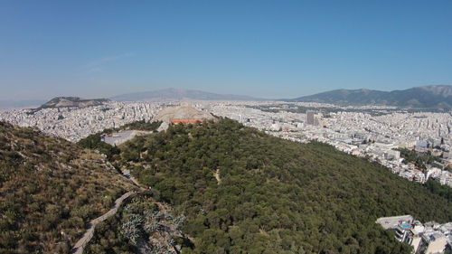 Scenic view of mountains against clear blue sky