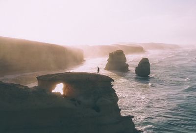 Man walking on rock formation