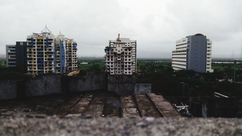 Buildings in city against sky