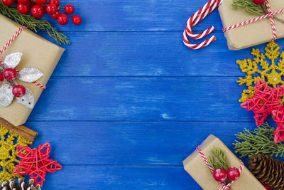 Christmas decoration side borders on blue wooden table with copy space. christmas background