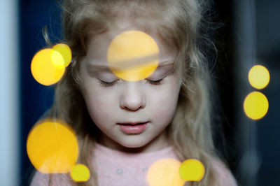 Close-up of girl with lens flare