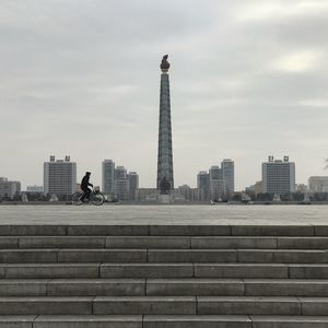 Low angle view of tower against cloudy sky