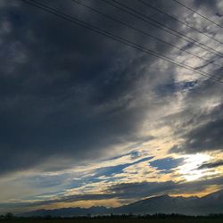 Scenic view of landscape against cloudy sky