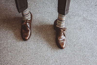 Low section of woman standing on floor