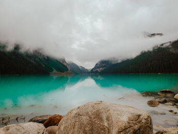 Scenic view of lake and mountains against sky