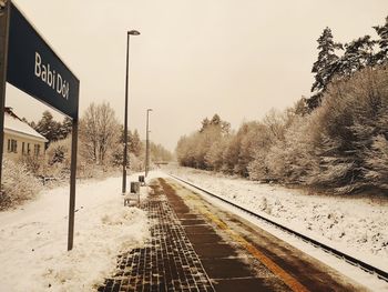 View of railroad tracks against sky during winter