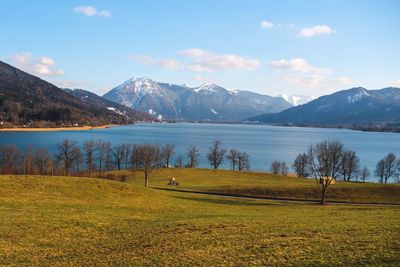 Scenic view of lake and mountains against sky