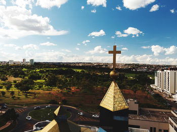 Tower amidst buildings against sky in city